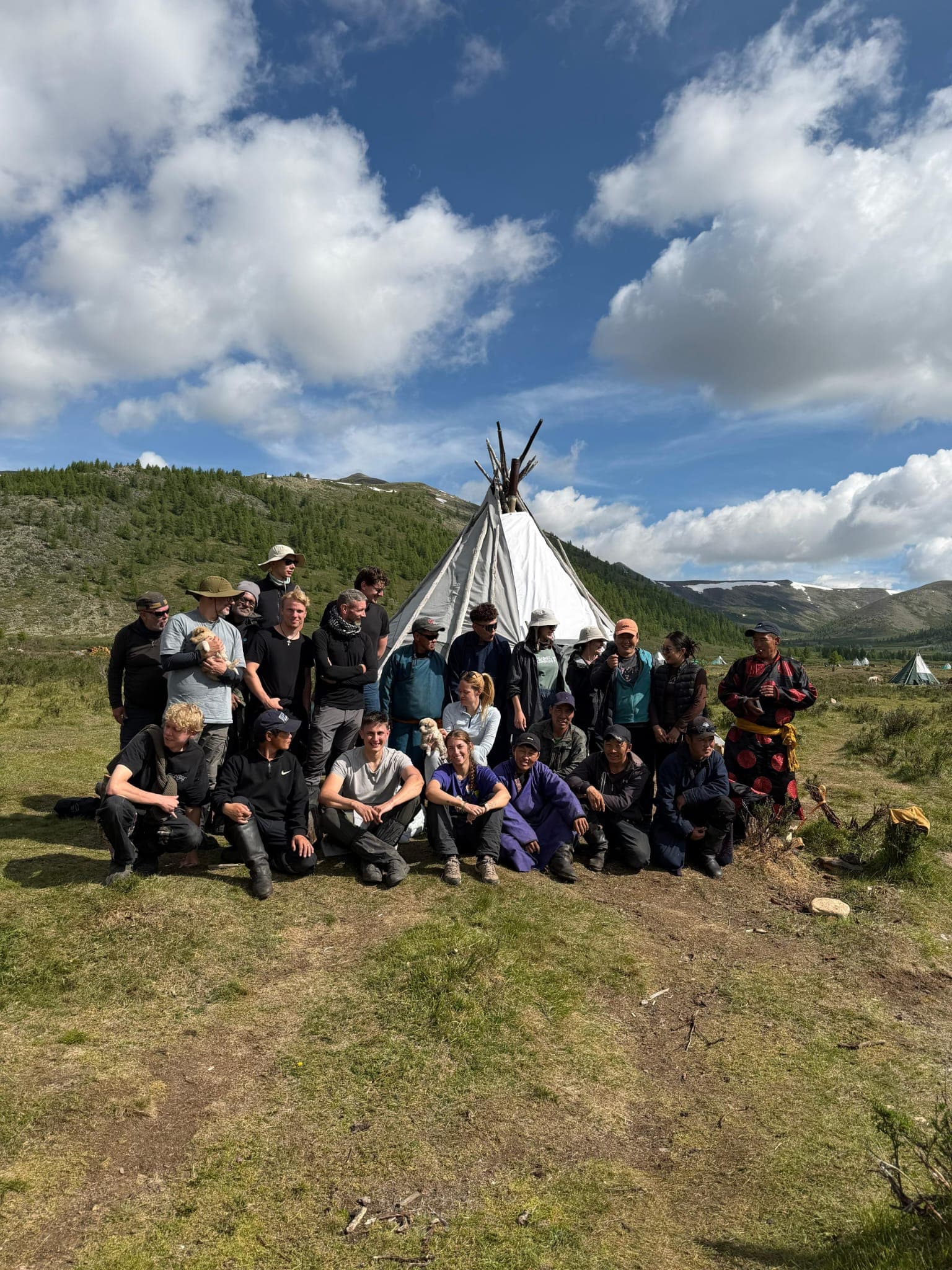 The whole group gathered in front of a ger at camp in Mongolia
