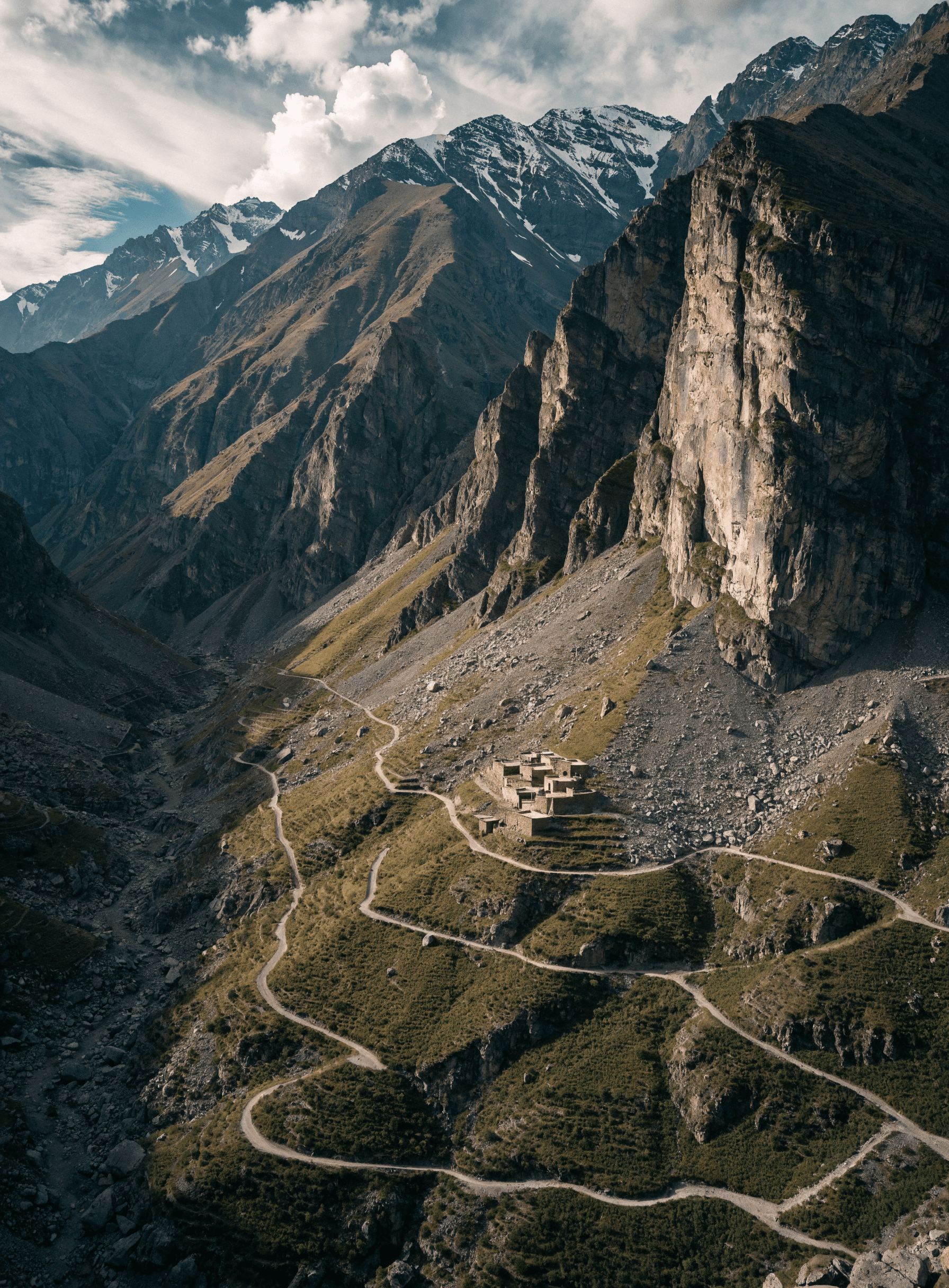 A remote village terraced into a dramatic Central High Atlas mountain valley