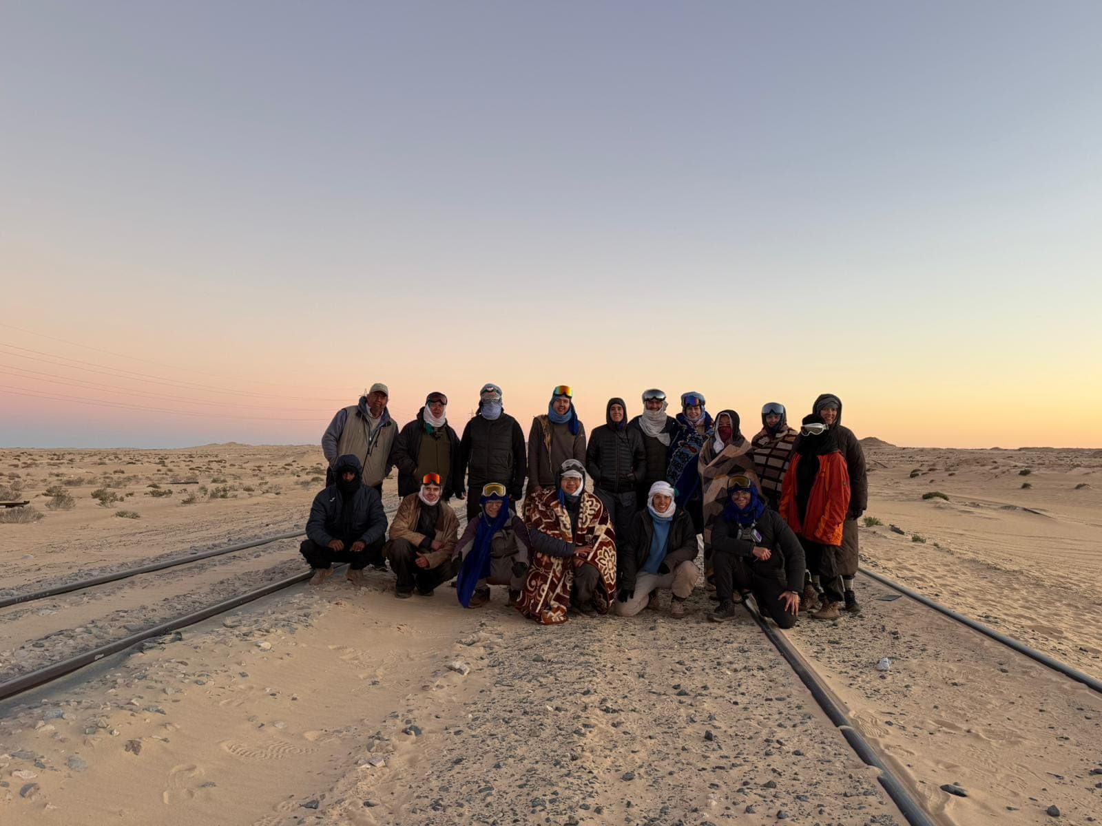 The full group at the iron ore train tracks at dusk
